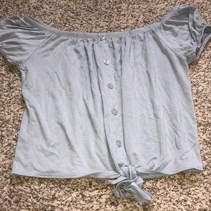 Off the shoulder blue top that ties at the bottom.